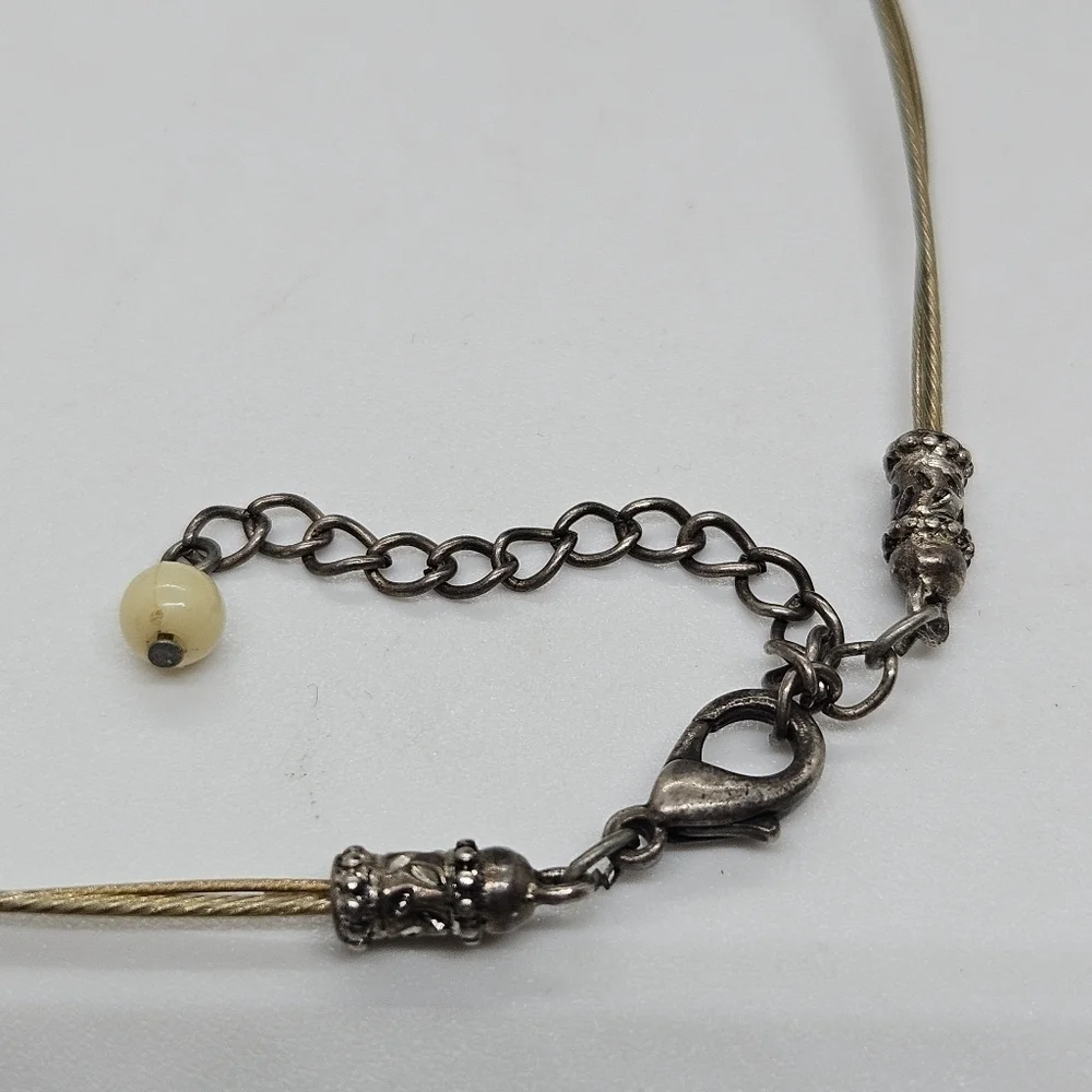 short wire necklace with large round shell pendant